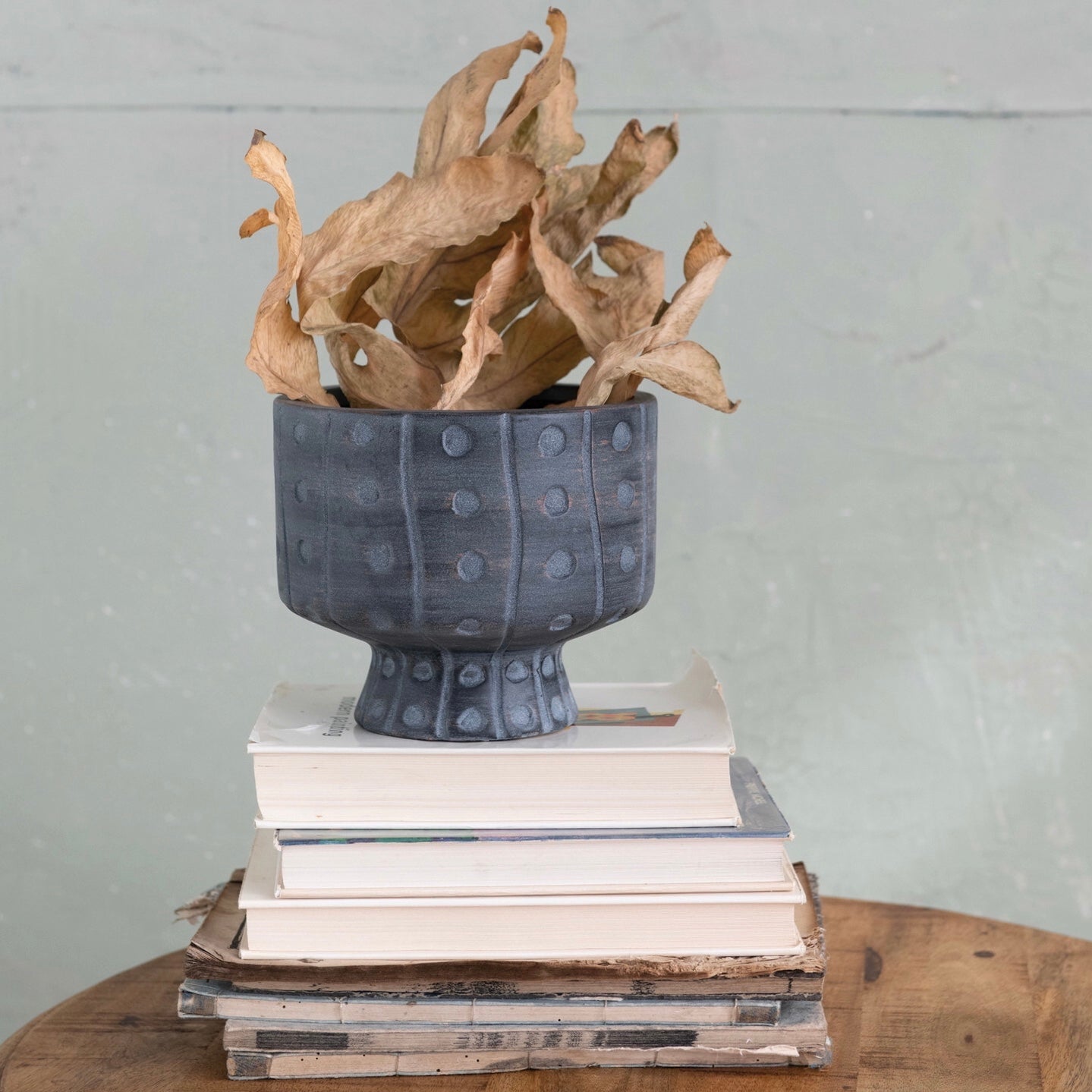 http://shopblytheinteriors.com/cdn/shop/products/planter-footed-stoneware-debossed.jpg?v=1666387835